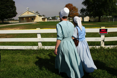 cityRUNDATE:100406--Two Amish young women from Michigan came to the West Nickel Mines Amish School, Wednesday, Oct. 4, 2006, to grieve for the killed children that were shol on Monday, in Lancaster County. The two came with a small group that had came to Pennsylvania for a wedding.(PHOTO BY GARY DWIGHT MILLER)